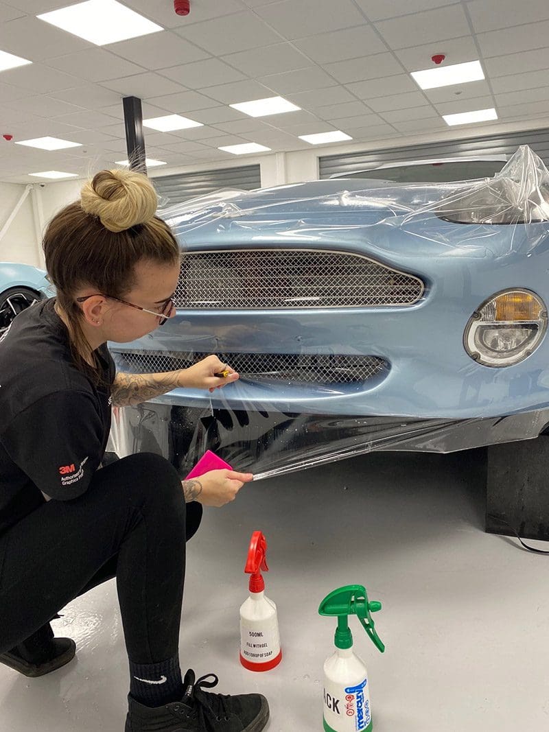 Image of Aston Martin DB7 getting wrapped for the blog Can Vinyl Wrap Be Removed