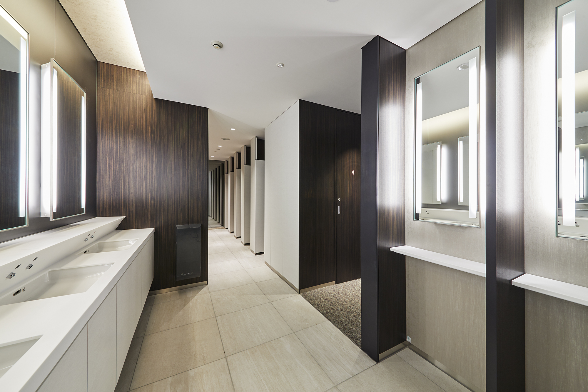 Image of toilet cubicles redesigned by Joyce Design using DI-NOC vinyl wrapping. 