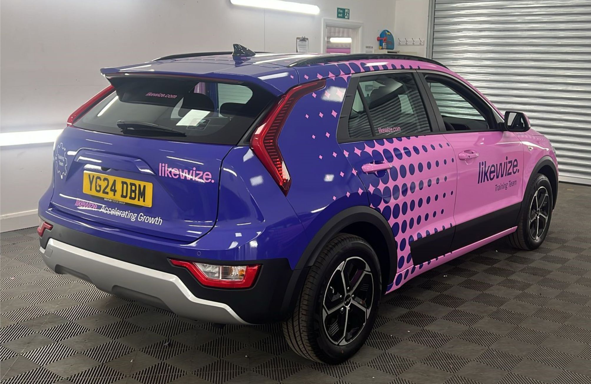 Niro car wrapped in pink and purple vinyl to illustrate Joyce Design case study for Likewize. 